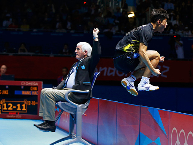 Winners and losers: China's Zhang Jike celebratesmen's singles gold medal table tennis match