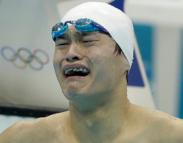Winners and losers: Sun Yang reacts after winning in the men's 1500-metre freestyle 