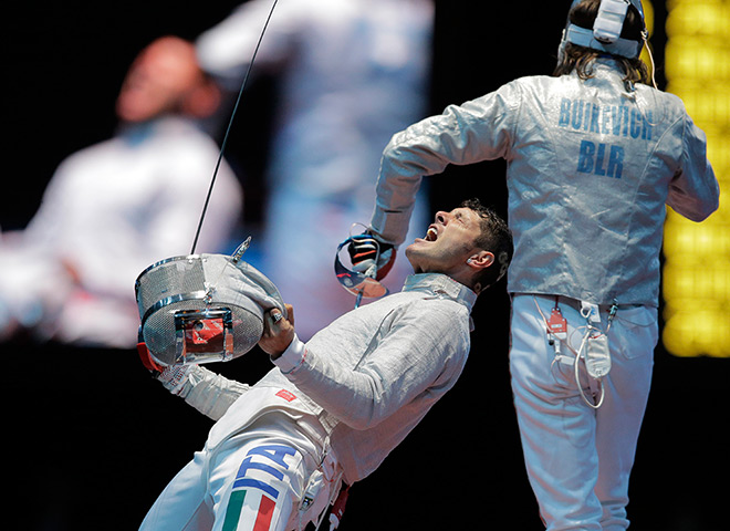 Winners and losers: Aldo Montano and Aliaksandr Buikevich at men's team saber fencing
