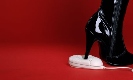 Leather fetish boot standing on a computer mouse