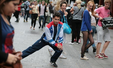 Stretching credibility … Kingsley performs a lunge in a London crowd. 