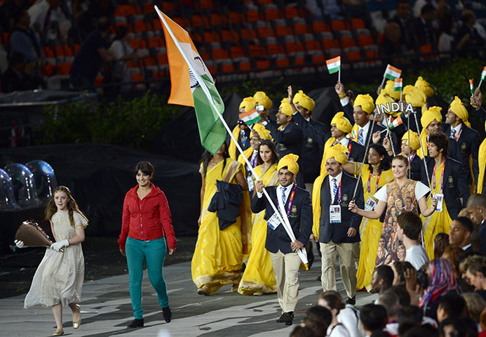 10 best: An unidentified woman (2L) walks with th