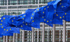 EU flags are seen out outside European Commission headquarters in Brussels
