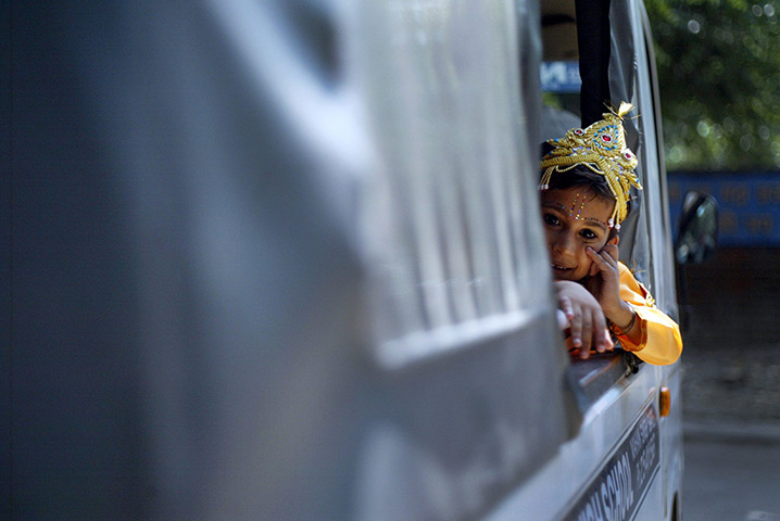 24 hours: Amritsar, India: A child dressed as Hindu God Lord Krishna