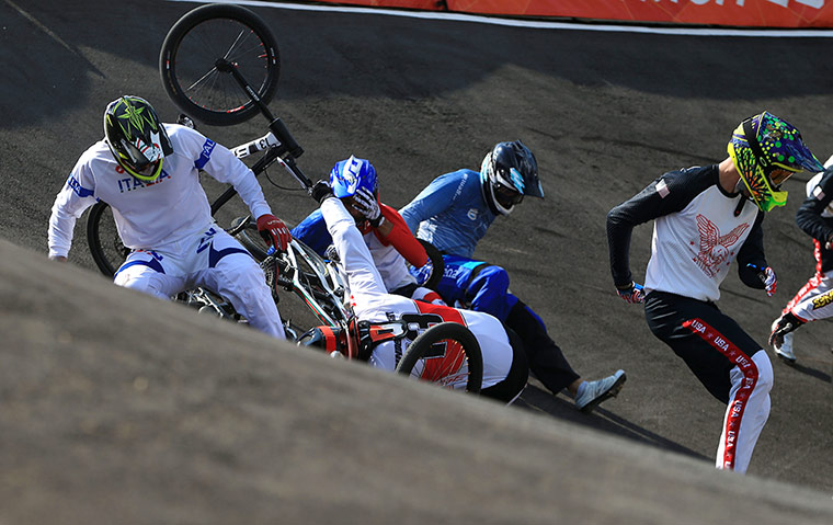 BMX Crash: Italy's Manuel de Vecchi goes to ground as the pack crash on the berm