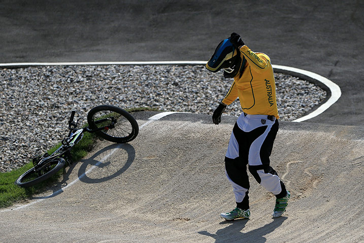 BMX Crash: Khalen Young of Australia holds his head after crashing
