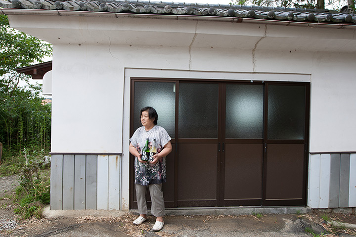 Soma, Japan: Chieko Sasaki, 66, stands outside the storehouse in which she makes sake