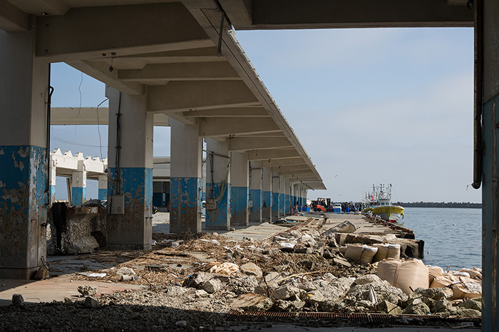 Soma, Japan: Fishing boats arrive at the fish market landing area