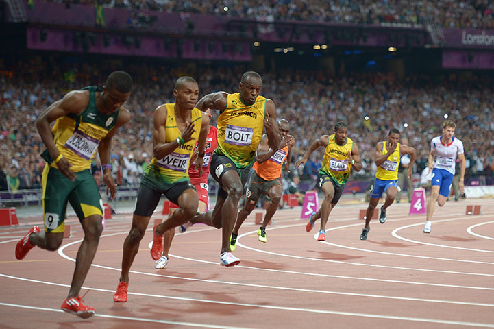 200m tom jenkins: Jamaica's Usain Bolt (C) competes to win