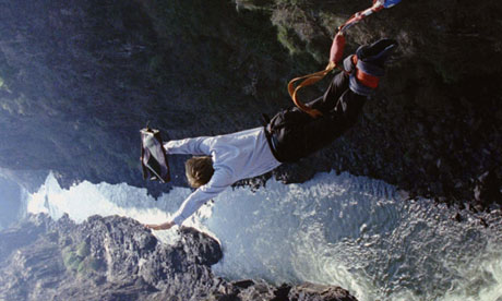 OPPENHEIMER DIVES OFF THE VICTORIA FALLS BRIDGE IN A BUNGEE JUMP STUNT