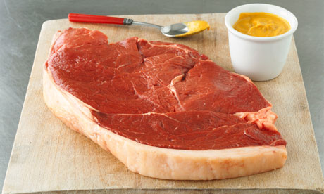 A raw steak and some English mustard