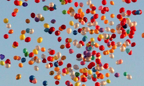 Thousands of balloons fly