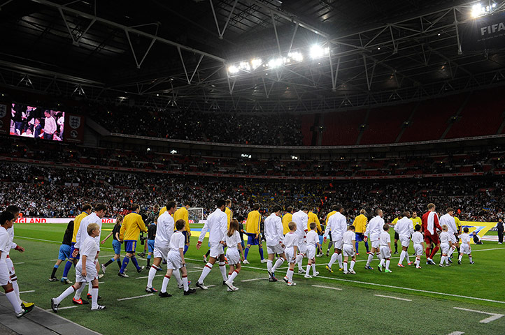 England v Ukraine: The teams come out to a not quite full Wembley Stadium