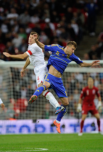 England v Ukraine: Gerrard and Iarmalenko go up for a high ball