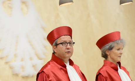 The President of the German Constitutional Court Andreas Vosskuhle (L) reads the verdict on Germany's ratification of the European Stability Mechanism (ESM) and fiscal compact on September 12, 2012 in Karlsruhe, Germany.