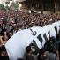 Benghazi protest: Egyptian protesters holds a giant banner reading 'the Prophet' in Arabic