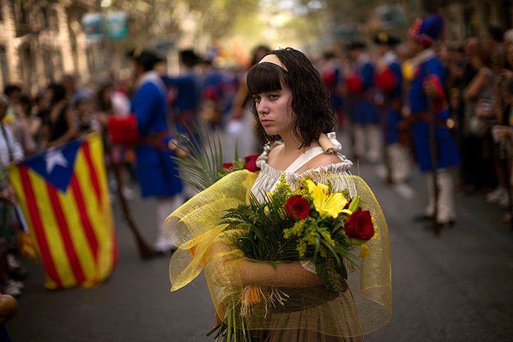 24 hours: Barcelona, Spain: A woman at a demonstration for Catalonia independence