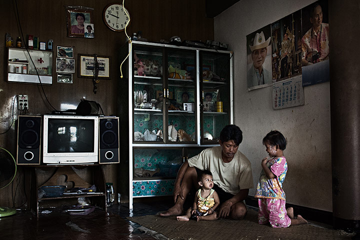 A Moken family in their house