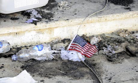 A US flag lies amid the rubble at the US consulate in Benghazi, Libya,where Chris Stevens was killed