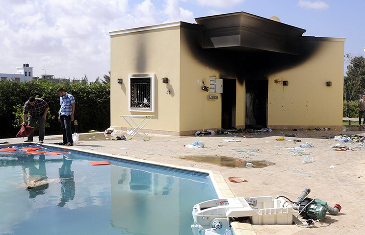 Libya protests: People inspeact damage in the grounds of the gutted US embassy in Benghazi