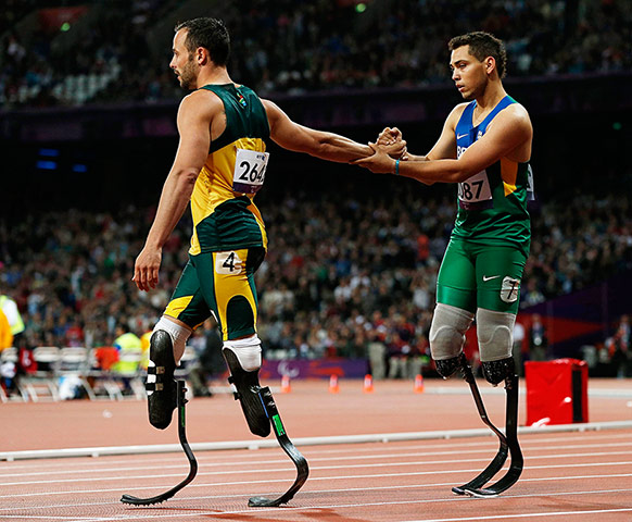 Battle games: Brazil's Alan Oliveira is congratulated by South Africa's Oscar Pistorius
