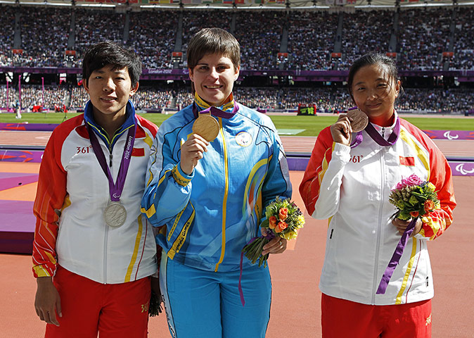 Battle games: Ukraine's Mariia Pomazan (C) poses for p