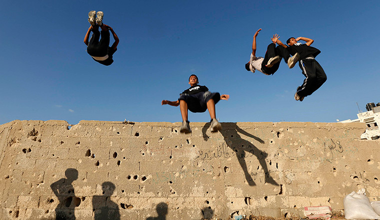 24 hours: Khan Younis, Gaza Strip: Palestinian youths practice their parkour skills