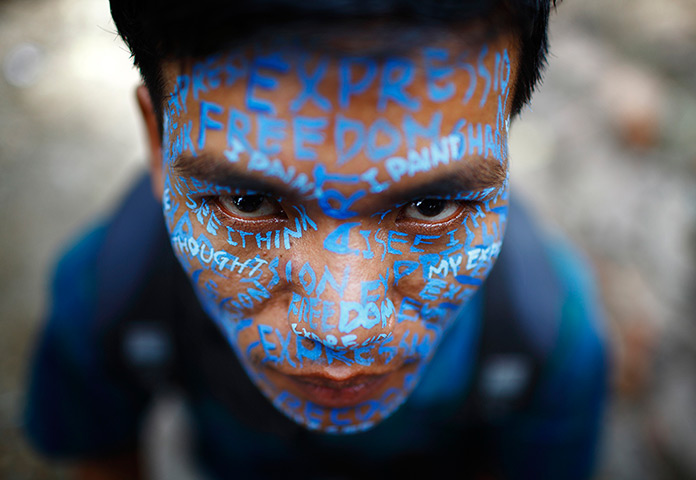 24 hours: Kathmandu, Nepal: An artist with his face painted 