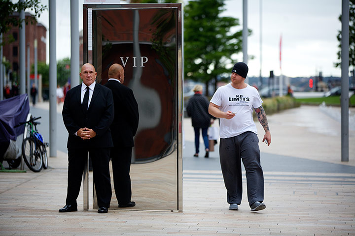 Liverpool biennial: A bouncer stands guard for But I'm on the Guest List Too