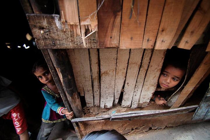 24 Hours: Jammu, India: Children from a shanty town look out