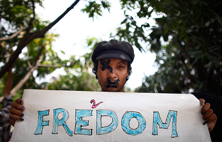 24 Hours: Katmandu, Nepal: An artist protests as part of a demonstration