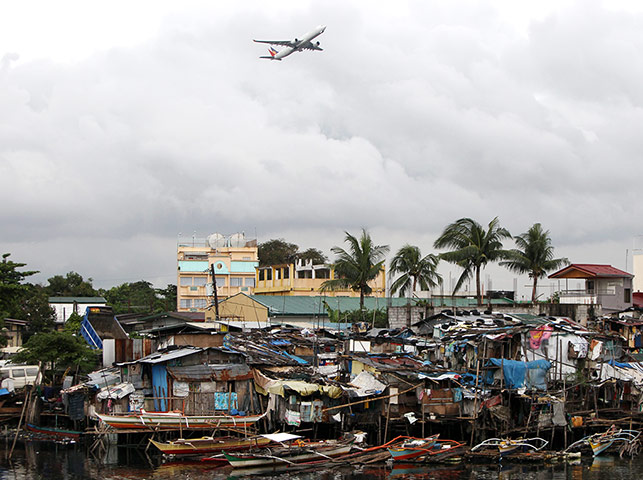 24 Hours: Manila, Philippines: A plane takes off from Manila's international airport