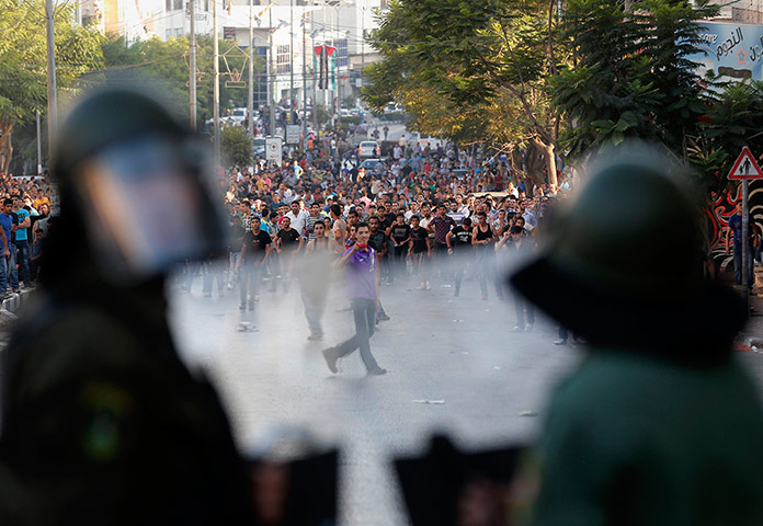 20 photos: Palestinians security officers clash with protesters in Hebron