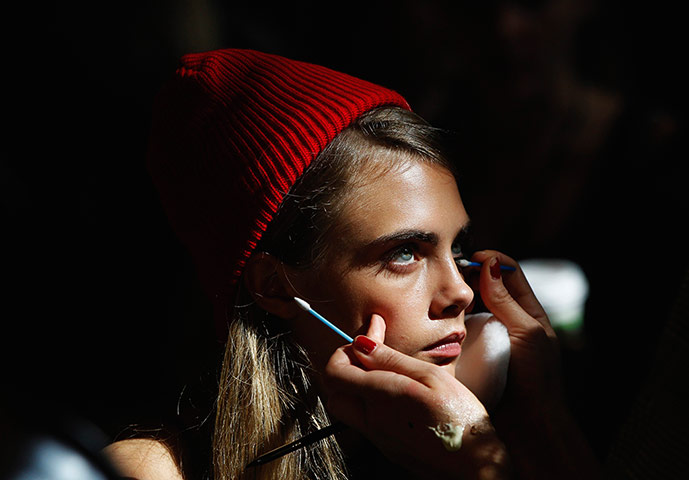 20 photos: A model has her make up done backstage during New York Fashion Week