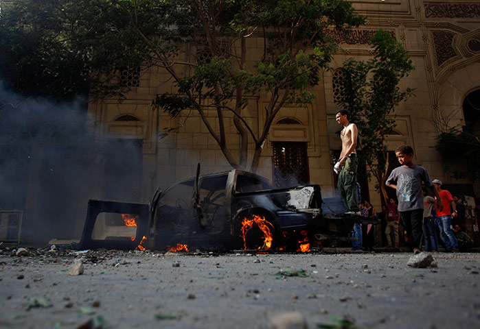 20 photos: An Egyptian protester during clashes near the US embassy in Cairo