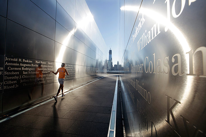 20 photos: A runner glides his hand along the wall of Empty Sky, New Jersey's memorial