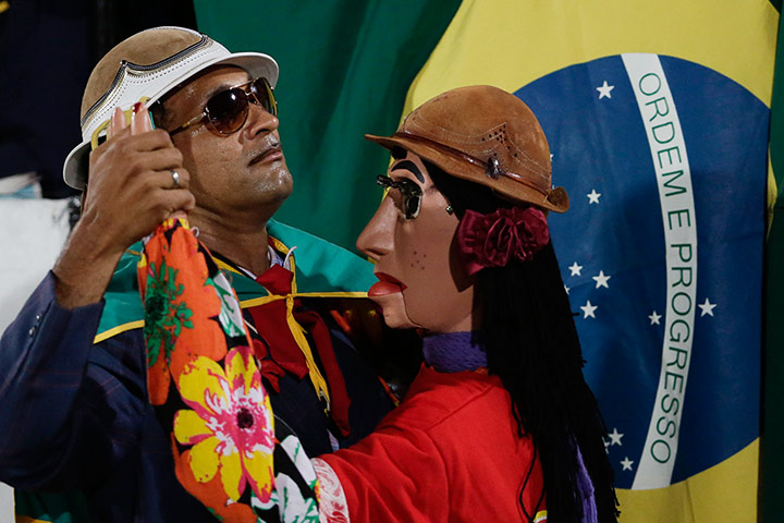 Best of the week: Fan and doll at football match 
