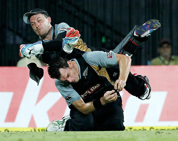 Best of the week: New Zealand's wicketkeeper Brendon McCullum collides with Kyle Mills 