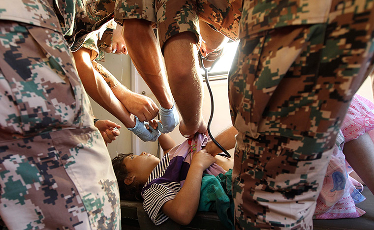 24 hours: Thnebeh, Jordan: A young Syrian refugee receives treatment 