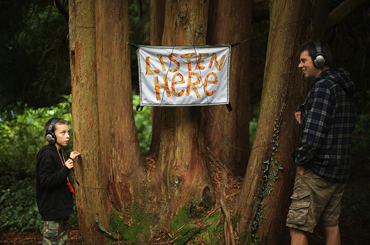 Festival No 6: Visitors enjoy the woodland art and music trail 