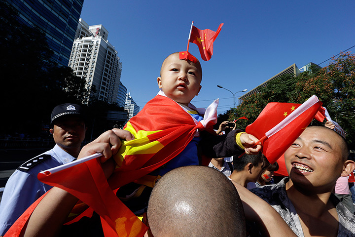 Anti-Japan protests: A young child draped in a Chinese national flag