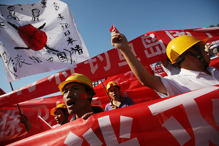 Anti-Japan protests: Chinese migrant workers protest outside the Japan Embassy in Beijing