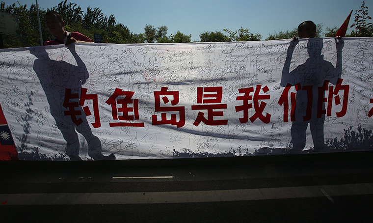 Anti-Japan protests: Chinese demonstrators hold up a banner 