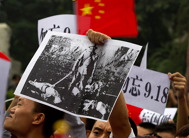 Anti-Japan protests: Chinese demonstrators waves flags in Chengdu