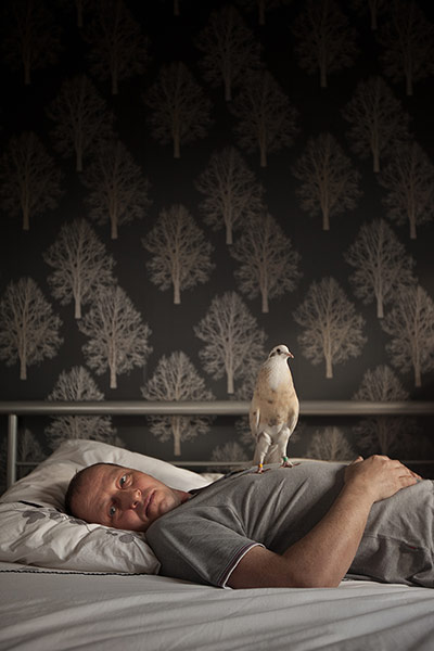 Scottish pigeons: Paul Smith, 43, with one of his birds in Muirhouse, Edinburgh