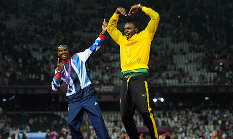 Usain Bolt and Mo Farah celebrate by doing each other's famous poses on the podium