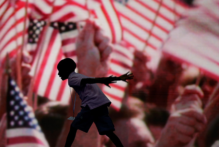 24 hours: Charlotte, North Carolina, USA: A boy runs at the Deomcratic convention