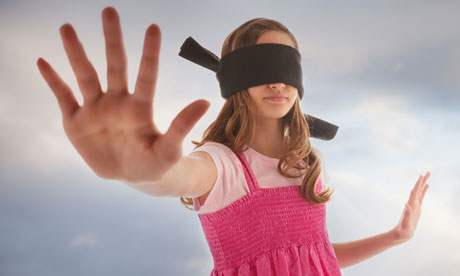 Blindfolded teenage girl