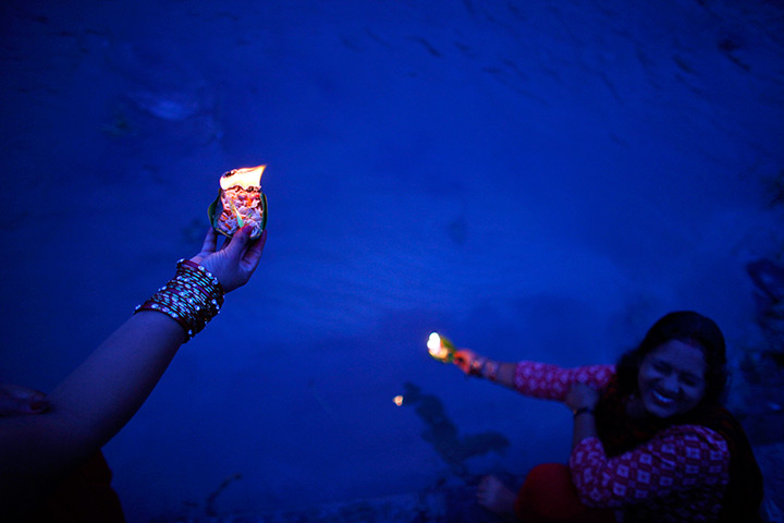 24 hours in pictures: Nepalese devotees perform rituals on the banks of the Bagmati river