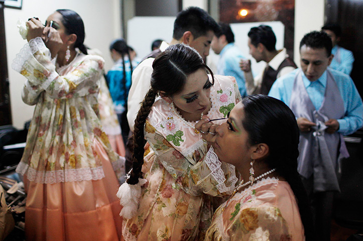 24 hours in pictures: Bolivian dancers prepare backstage